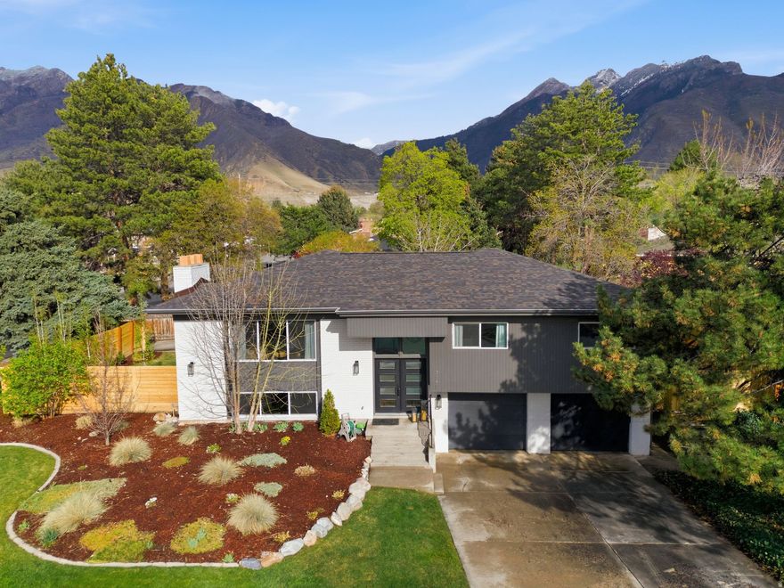 **Multiple Offers Received - Final Offers due by 5:00pm on Monday 4/6** Rarely does a home like this become available in Cottonwood Heights. Perfectly tucked between Big and Little Cottonwood Canyon on a quiet cul-de-sac, this thoughtfully updated residence offers the ideal blend of comfort, style, and location. The home has been exceptionally well cared for, featuring a newer roof, new fencing, and quality updates throughout. Inside, you will find a spacious and inviting layout with an open great room, two real wood fireplaces, and a beautifully designed kitchen with expansive countertops, included appliances, and a warm wood beam detail that perfectly complements the mountain setting. The primary suite offers a true retreat, while large above grade basement windows bring in natural light and create a bright, livable lower level. The outdoor space is equally impressive with mature pines and aspens creating privacy, a large covered deck for year round enjoyment, an open patio with a basketball hoop, and a dedicated fire pit area designed for gathering. A two car garage is complemented by rare additional parking ideal for an RV or extra vehicles. The location is exceptional, offering walkability that is hard to find. The Cottonwood Heights Recreation Center and outdoor pool are just half a mile away, with multiple parks, restaurants, and all assigned public schools within walking distance, including the elementary school just one block away. You are also perfectly positioned for seamless access to world class skiing, hiking, and biking in both Big and Little Cottonwood Canyon. This home places you at the center of one of Utah's most sought after lifestyles.