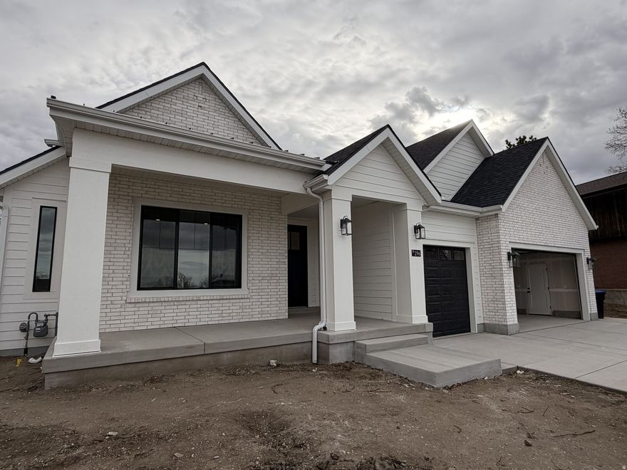 Beautiful Baychester home on Lot 2 with 3-car garage and designer finishes throughout. Features open main floor living with 9' ceilings, gas fireplace, and gourmet kitchen with quartz counters, shaker cabinets, and premium stainless appliances. Luxurious master suite includes soaking tub, frameless shower, and dual vanities. Energy-efficient design with 10-yr structural warranty for peace of mind.