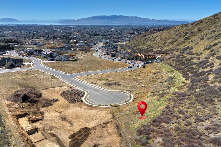 A piece of heaven at The Ridge at Alpine, an exclusive community in Alpine, Utah. This stunning location offers majestic mountain views and a breathtaking picture of the valley below. With Mount Timpanogos stretching to the south and the towering peaks of the Wasatch Mountains, this one-of-a-kind lot provides a unique experience. Set at the base of the majestic Lone Peak Mountain, you'll be surrounded by open space and national wilderness, right in your own backyard. Lot number 11 is the premier lot in the entire community, boasting 1.45 acres and situated in the most private, quiet location. The Ridge at Alpine is part of one of the highest-ranking school districts in Utah, including Loan Peak High School. It's the finest building property in Alpine, located on a secluded cul-de-sac, making it the perfect spot for your dream home. Strategically placed on the Silicone Slopes, this exclusive lot is highly sought-after. Take a walk with us and imagine the serenity of coming home to The Ridge at Alpine.