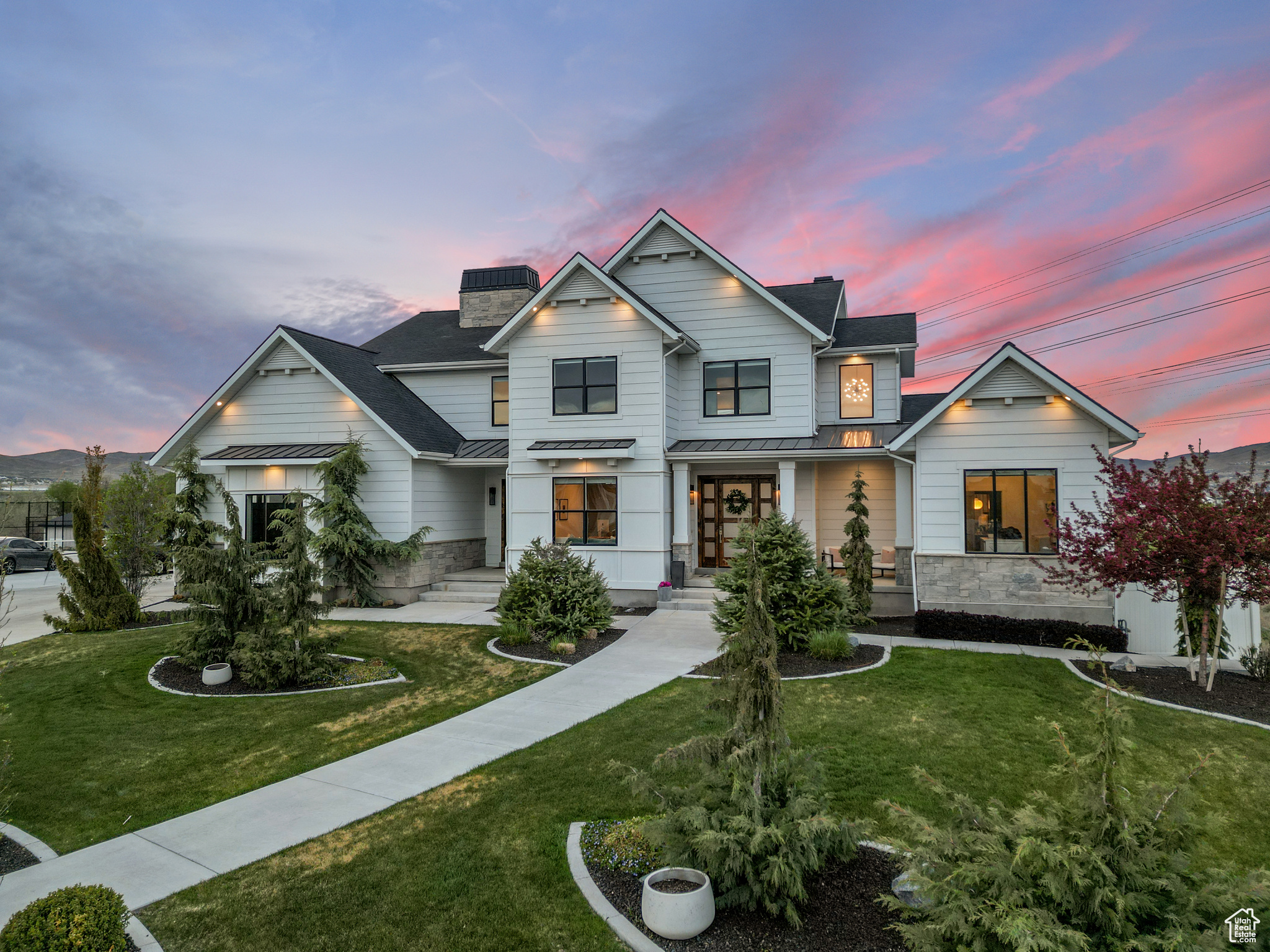 *THIS HOME TO BE FEATURED ON UTAH'S REAL ESTATE ESSENTIALS SUNDAYS ON ABC4*. Step into luxury with this stunning, one-of-a-kind home that truly has it all. Designed for both comfort and entertaining, this property features vaulted ceilings, custom cabinetry throughout, and a dream kitchen outfitted with top-of-the-line appliances and a spacious butler's pantry that houses a built in ice maker. Multiple dedicated office spaces allow working from home or homework to be effortless, while each level boasts its own spacious living area. The thoughtfully finished basement offers the flexibility of a high-end entertaining space or could be utilized as separate living quarters with its full kitchen and private access. Enjoy your own own spaces currently set up as a home gym and personal golf simulator, perfect for year-round fitness and fun. A separate mudroom entrance adds convenience, and there's abundant parking for any personal or recreational vehicles in the 1,472 garage. Outside, relax on the sizable covered Trex deck and gather around the built-in firepit. This home blends luxury and functionality in every detail.