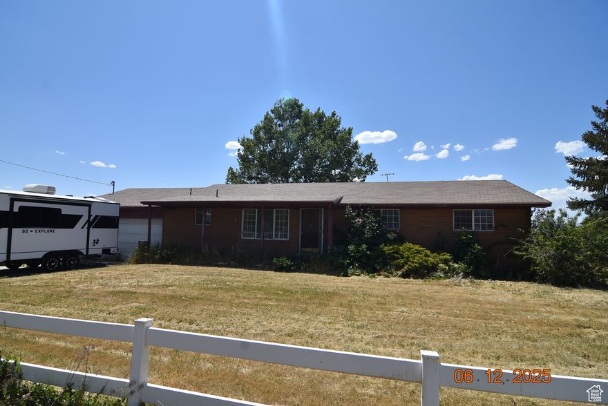 Don't let this property slip through your fingers.  41.24 acres made up of two parcels (24:010:0005 & 24:019:0014) with 57 Shares of Lakeshore irrigation.  Hay currently being grown and harvested.  There is a 3 bedroom, 1.75 bath brick rambler home the property.  Newer laminate flooring, gas forced-air furnace with central air, gas water heater, living room, family room, kitchen.  Owner's bedroom has a private 3/4 bathroom.    Square footage figures are provided as a courtesy estimate only and were obtained from Utah County records. Buyer is advised to obtain independent measurements and verify all information to their satisfaction. Wheel lines and farm equipment are not included.