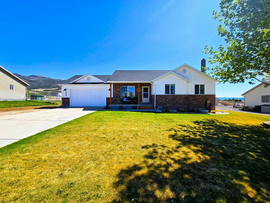 Panoramic mountain views meet comfort at 2026 E Saddleback View Dr. Bright living spaces, updated kitchen, finished basement with wood stove, large patio, shed. New roof/siding (2022) + new water heater. Quiet setting. Call agent for more details on shop.