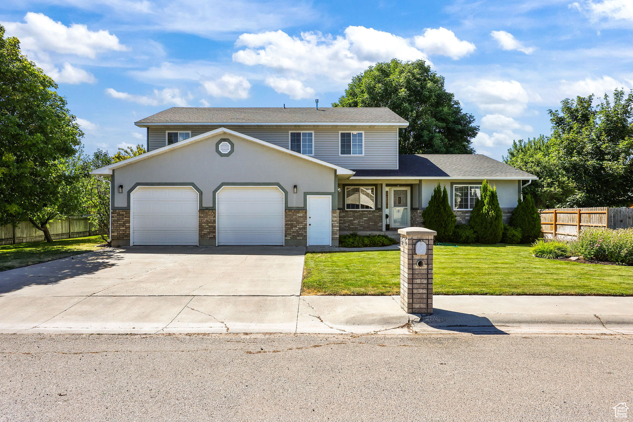 SELLER WILL PAY $10,000 towards buyers closing and financing fees or rate buy down. Beautiful 5-Bedroom Home Near the Preston Golf Course. Located in a desirable neighborhood just minutes from the Preston Golf Course, this well-cared-for 5-bedroom, 3-bathroom home offers comfort, space, and a great location. The oversized two-car garage and additional parking make it easy to store vehicles, toys, and more. The fenced yard provides privacy and features mature fruit trees, a basketball court, a patio, and a BRAND_NEW deck-perfect for enjoying warm summer evenings. The yard is beautifully maintained, offering a peaceful and inviting outdoor space. Inside, the main floor includes everything you need for everyday living, including a spacious master suite with a large walk-in closet. While upstairs you have more bedrooms and a large room that could be used for family gatherings, a game room, etc. the options are endless. The layout is functional and comfortable, while the home's upkeep shows pride of ownership throughout. With its prime location near the golf course, a beautiful yard, and plenty of amenities, this property offers a wonderful balance of neighborhood charm and convenience.