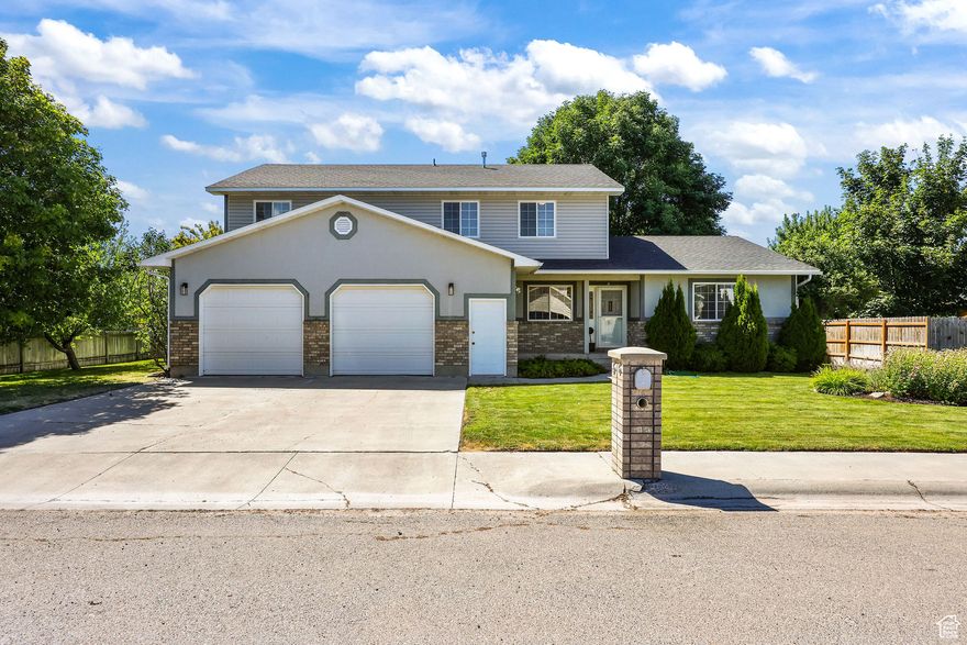SELLER WILL PAY $10,000 towards buyers closing and financing fees or rate buy down. Beautiful 5-Bedroom Home Near the Preston Golf Course. Located in a desirable neighborhood just minutes from the Preston Golf Course, this well-cared-for 5-bedroom, 3-bathroom home offers comfort, space, and a great location. The oversized two-car garage and additional parking make it easy to store vehicles, toys, and more. The fenced yard provides privacy and features mature fruit trees, a basketball court, a patio, and a BRAND_NEW deck-perfect for enjoying warm summer evenings. The yard is beautifully maintained, offering a peaceful and inviting outdoor space. Inside, the main floor includes everything you need for everyday living, including a spacious master suite with a large walk-in closet. While upstairs you have more bedrooms and a large room that could be used for family gatherings, a game room, etc. the options are endless. The layout is functional and comfortable, while the home's upkeep shows pride of ownership throughout.    With its prime location near the golf course, a beautiful yard, and plenty of amenities, this property offers a wonderful balance of neighborhood charm and convenience.