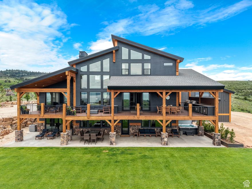 Stunning Mountain Modern Home on 5.22 acres with Sports Court & Breathtaking Lake Views located in the Canyon Estates Gated community at Bear Lake, ID.  Whether you're seeking tranquility, adventure, or the perfect space to entertain, this home has it all. Featuring panoramic Lake Views: Gaze at the crystal-clear waters of Bear Lake from nearly every room, Spacious & Open Floor Plan: Expansive windows bring the outdoors in, blending modern design with the beauty of nature. Gourmet Kitchen: High-end appliances, leathered granite countertops, butlers pantry, and plenty of space to cook and entertain. This home consits of 6 bedrooms, 6 full bath 2 half bath, indoor sports court, theatre room, office, workout room, built in kitchen on the deck, hot tub, high end luxury finsh work throughout, walk out basement to a pristine landscaped yard. Home is being sold with most primary furnishings contact agent for more details. Whether you're searching for a permanent residence or a vacation getaway, this mountain modern home will exceed your expectations. Don't miss out on the opportunity to own a piece of Bear Lake paradise!