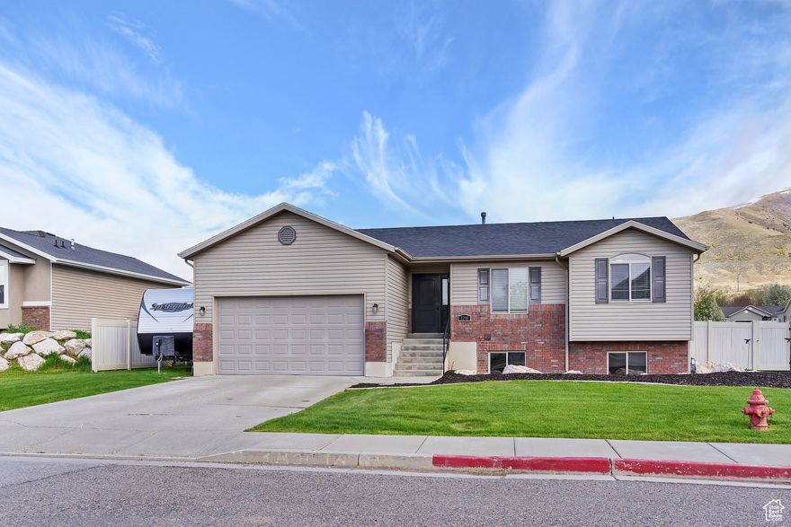 Charming rambler on a spacious corner lot in Cherry Ridge! Featuring a newer roof, newer heating & cooling, fresh flooring throughout, and a beautifully re-landscaped backyard with improved drainage. Primary suite with private bath. Enjoy mountain & lake views, RV parking. Truly move-in ready-schedule your private showing today!