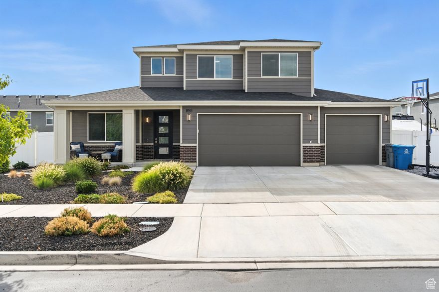Welcome to a rare find in the coveted Stonecreek community. This "Addison" floor plan is where style, function, and comfort come together. The main-level Owner's Suite feels like your own private sanctuary, complete with a spa-inspired bath and an oversized walk-in closet, while two additional bedrooms upstairs each have walk-in closets of their own. A bright loft and spacious office make it easy to work or unwind in style. Your new gourmet kitchen features marble-like quartz countertops, natural gas cooking, and stainless steel appliances, setting the stage for everything from quiet mornings to lively dinner parties. This home elevates everyday living with thoughtful touches like built-in surround sound, permanent holiday lighting you can control from your phone, and an oversized garage with RV parking. The Xeriscaped yard is as effortless as it is beautiful, giving you back more time to spend where it matters most...on the lake. Easy maintenance is the name of the game allowing you to jump on your outdoor adventures even faster! With the extended garage, RV parking and Utah Lake being just a few minutes away, this location is a boating enthusiasts dream. You will also love convenient proximity to shopping, restaurants, movie theaters, and access to I-15. Welcome to a home that's well positioned, elegant, smart, and perfectly low-maintenance, this is Stonecreek living at its finest.