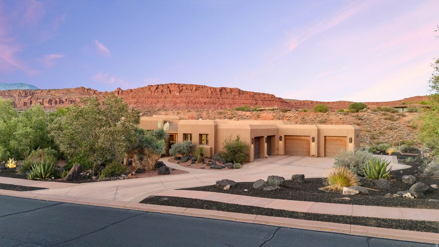 You know that feeling when a place immediately slows your heartbeat a little? That's this home. You walk through the private front courtyard, open the front door, and before you notice a single finish or detail inside, your eyes go straight through the wall of windows to the red rock cliffs beyond. It's the kind of view that stops conversations mid-sentence. The kind that made the current owners say yes the moment they stepped inside. Set on .69 acres within the gates of Entrada, the home was carefully positioned to create an incredible sense of privacy. Instead of looking into neighboring homes, nearly every angle frames desert landscape, golf course, lava rock, and open sky. Hawks drift overhead. Hummingbirds move through the courtyard. At night, it becomes quiet in a way that's hard to find this close to the city. And yet, you're not removed from life, you're right in the middle of one of Southern Utah's most sought-after communities. Golf, dining, and the Entrada clubhouse are just moments from your door, while the energy of St. George sits right outside the gates when you want it. The layout balances comfort, flexibility, and hospitality beautifully. The casita with its own kitchenette gives guests a stay that feels private and elevated. A dedicated theater creates the perfect escape for movie nights and game days, while the flex room off the garage can easily become a gym, studio, hobby space, or additional storage for an active lifestyle. With 3 bedrooms, 3.5 baths, unforgettable views in every direction, and a setting that feels connected to nature without sacrificing convenience, this is more than a home, it's the experience people hope for when they imagine living in Entrada.