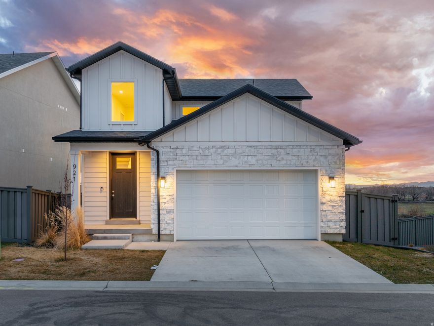 Shows like new and ideally located just minutes from Farmington Station, Lagoon, and with quick access to I-15, making shopping, dining, entertainment, and commuting incredibly convenient. This home also offers excellent flexibility with its main floor private suite with attached laundry and a fully finished walkout basement featuring private exterior access and plumbing already in place for a future kitchenette-ideal for additional living space, extended family, or a home salon. Quality finishes throughout along with epoxy-coated garage floor and second washer and dryer included in the sale. Call/text the listing agent, Mike Gooch, to tour your future home!