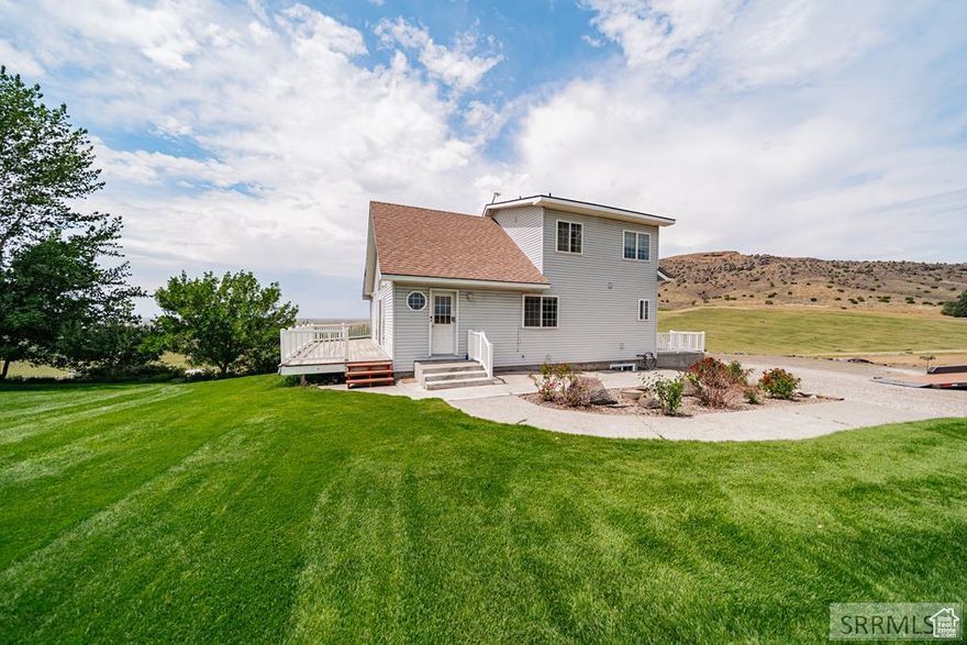 RENTAL AVAILABLE Horse Property! 3+build rights, Stunning Views, Arena & Walk-Out Basement! Wake up to the Menan Butte & 8.54 acres designed for country living at its finest. 4-bed, 3-bath home welcomes you with vaulted ceilings, a wrap-around deck & SUNSETS, open floor plan filled with natural light, easily controlled by elegant roller shades. Two private en-suite baths, while the kitchen shines with new stainless appliances & a gas stove-all upgraded within the last three years. Hardwood stairs & kitchen floors add warmth, with a flooring allowance so buyers can customize to their taste. This property is built for comfort and efficiency, featuring a brand-new high-efficiency gas furnace & water heater, a variable-speed well pump, and a portable generator ensuring reliable power in any situation. The heated tack room & spacious shop provide year-round convenience for horse enthusiasts and hobbyists alike. Step outside into your own private retreat. A lush garden, cozy fire pit, and full sprinkler system make outdoor living effortless. The horse arena & fenced pasture are perfect for equestrian pursuits, while direct access to BLM & state land, Snake River views, hiking & ATV/UTV trails ensures endless adventure, and wildlife daily!