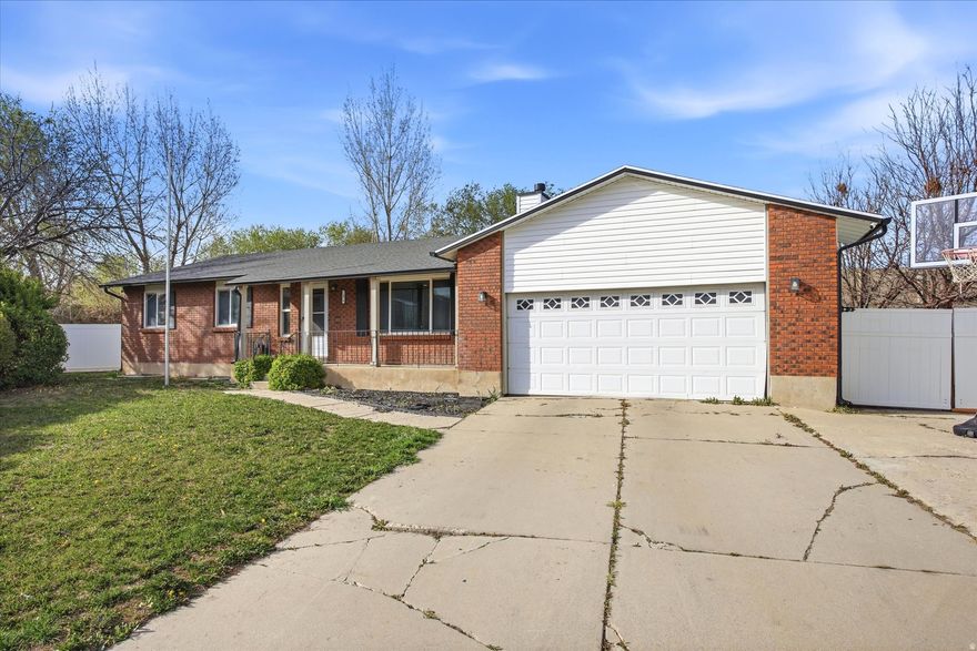 Welcome to this beautifully updated 5-bedroom, 3-bath home in the heart of Taylorsville. From the moment you walk in, you'll notice the bright, open layout designed for both everyday living and entertaining. The fully remodeled kitchen features modern cabinetry, stainless steel appliances, a spacious island, and flows seamlessly into the main living area with a cozy fireplace and updated finishes throughout. The main level offers comfortable living with generous bedroom space, while the finished basement provides additional flexibility for guests, a home office, or extra living space. With five total bedrooms, there's room for everyone. Major systems have already been taken care of, with the furnace and A/C both less than 5 years old, giving added peace of mind for years to come. Outside, you'll find a large yard with mature trees, a covered front porch, and plenty of parking with an attached garage and extended driveway. Conveniently located near parks, schools, and shopping, this home combines comfort, style, and accessibility. This one checks all the boxes, come see it for yourself.