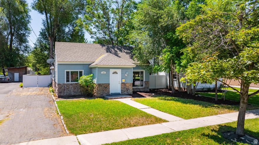 Come see this charming home in the heart of Provo! Whether you are looking for yourself or for your perfect investment property, this home cannot be missed! Located within 2 blocks of downtown and just outside of a mile to BYU, this prime location is perfect. Spend lazy summer evenings on the covered back patio by the outdoor fireplace or a little further out roasting marshmallows with the firepit under mature trees. Inside, the bathroom and kitchen has been remodeled and includes quartz counter tops, original hardwood floors, stunning bathroom surrounds and so much more! Schedule your private showing today!   Square footage figures are provided as a courtesy estimate only and were obtained from county records.  Buyer is advised to obtain an independent measurement.