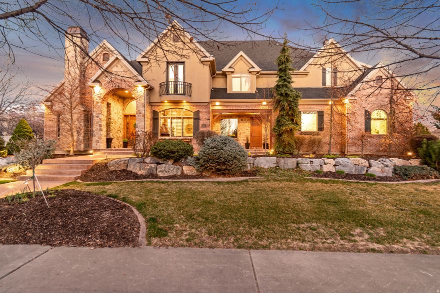 Location changes everything.  RARE OPPORTUNITY in the coveted Twin Rivers neighborhood where people don't want to leave.  It's the perfect blend of LUXURY & LOCATION.  This is your new WALKABLE life  to schools, parks, tennis/pickleball courts, football practice, you name it.  Leave your car and just LIVE on this quiet tree-lined street at the CENTER of it all.  NEW Roof, NEW Solar, NEW HVAC, NEW Smart Features.  The CRAFTSMANSHIP, the WINDOWS AND VIEWS, the real-life function, and open-concept entertaining elements of this home will truly take your breath away.  This STUNNING property was built to perfection with its 20' vaulted wood-beam coffered ceiling in the great room - with two story windows filled with east mountain views - and 16' massive kitchen island.  Greeted by an impressively curved, freshly carpeted stairway in the entry, be prepared to be charmed from room to room.  For starters, the front den with fireplace has unique private access to the primary suite which boasts 14' vaulted ceilings, luxury vaulted bath with stain glass window, mountain-filled bedroom windows, outdoor access to your own private deck, and another outdoor access to the main deck.  The updated kitchen with beautiful high-end cabinetry, two Sub-Zero refrigerator/freezers, two Bosch ovens, two dishwashers, a powerful 6-burner 48" Wolf range, and even a butler's pantry.  Huge energy savings with the owned Solar panels and double insulation.  Fresh NEW paint, solid wood doors and trim everywhere, tall ceilings throughout, meticulously cared-for stone and wood flooring, and warm rock accents that pull you in to stay.  The mudroom front entrance is perfect for kids walking to and from school, practice at Burgess Park, or afterschool activities, right into the main floor laundry room, complete with lockers galore and even a "dog food drawer".  In fact, this home has three total laundry areas (yes, three) and storage everywhere - including a 6' tall storage room above the primary bedroom closet.  Did we mention views?  The sweeping new Trex deck off the great room offers stunning outdoor living - a shaded afternoon and evening sanctuary, complete with east mountain views, flowing water feature, and lush mature landscaping with smart sprinklers.  Step down to a generous backyard, flat and wide for a pool if you wish, with garden boxes, peach trees, a trampoline and basketball sport court  just the right size of a pickleball court.  Upstairs you'll find five large, charming bedrooms, each unique and special in their own way- a Juliet balcony here, a loft or two there...all special retreats, along with two full baths.  A back stairway off the kitchen takes you up to a second great room and wet bar - perfect for kids and teens.  The upstairs features an impressive overlook down to the main level great room, keeping everything feeling open and airy.  Also, for the littles in your life, a special loft play area just their size.  The walkout basement appeals to downtime and entertaining: movies in the big screen theatre room, guest room and full bath, and a naturally lit yoga room with patio access to the hot tub.  And finally, this basement boasts a massive accessory apartment with three bedrooms, two baths, a great room and patio off an enormous kitchen.  With its dedicated furnace and two private entrances, this oversized apartment commands a generous monthly income of $2000/month or more.  Last, but never least, is the oversized four-car garage with its 13.5' ceilings and extra-tall smart garage doors  fit for a boat.  Two extra-large storage rooms off the garage keep things put away, and of course a 240V/50A Level 2 EV charger.  Outside is an RV pad with a direct sewer connection.  Alarm system, Radon Mitigation System, Google Wi-Fi Mesh Network throughout...the extras are simply endless; it's the home of a lifetime.  Don't miss this RARE gem in the HEART of Alpine.