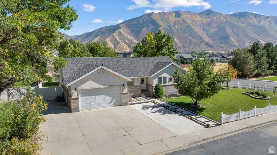 Rare Mapleton rambler in a coveted neighborhood, this 6-bedroom, 3-bath home offers the perfect balance-close to conveniences yet away from the city bustle. With an open-concept floorplan, main floor living, abundant storage throughout, and thoughtful updates including fresh new paint, flooring, and a brand-new furnace, this home is truly move-in ready. The spacious fenced corner lot is a true retreat, blending beauty and function with raised garden boxes, grape vines, mature fruit trees (mulberry, nectarine, peach, pear, and Honeycrisp apple), a huge covered patio perfect for entertaining year round, RV parking, and a dedicated play area for kids-all framed by breathtaking mountain views. Square footage figures are provided as a courtesy estimate only. Buyer is to verify all information.