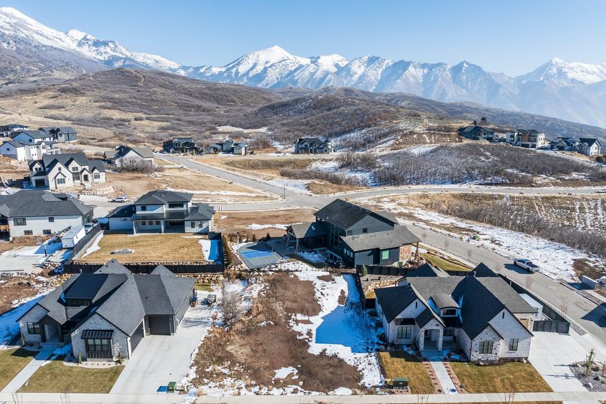 Nestled in the scenic foothills of Draper, this lot offers breathtaking mountain and valley views in the highly sought-after Lone Peak Canyon community. Buyers may bring their own builder and customize a home that fits their vision, or purchase an available plan designed specifically for the lot. Save time and start building immediately. Enjoy direct access to Corner Canyon's extensive trail system just steps away, ideal for hiking, biking, and outdoor recreation. Despite the peaceful mountain setting, the property is conveniently located just minutes from I-15, downtown Draper, and Lehi's Silicon Slopes.