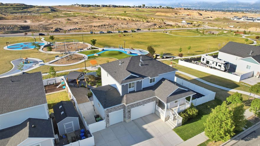 Rarely does a lot like this become available in Maple Hills. Backing directly to Maple Hills Park with trail access right next door, this home offers unobstructed views, open space, and a backyard setting that truly sets it apart. When people talk about lot premiums, this is exactly the type of property they mean.  Located in one of West Jordan's fastest growing and most convenient areas, you are just minutes from shopping, dining, schools, parks, and easy access throughout the valley while still enjoying the quiet community feel that makes Maple Hills so desirable.  Inside, the home features a functional and versatile layout with five bedrooms, including a main floor bedroom next to a three quarter bath that works perfectly for guests, a home office, or multigenerational living. Upstairs offers a spacious loft area, while the walkout basement features impressive nine foot ceilings and opens directly to the backyard.  The outdoor space is truly a highlight with beautiful stamped concrete, a pergola, direct park access, and a setting that is incredibly hard to find. Combined with a three car garage and a price point that makes strong sense for the area, this home offers the full package in one of West Jordan's most sought after neighborhoods.