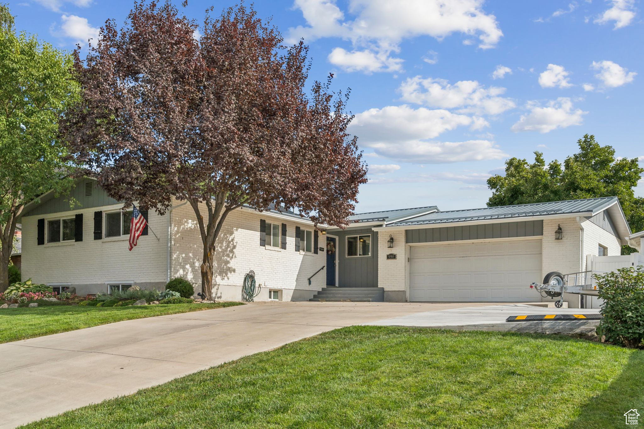 Don't miss out on this wonderfully kept Kaysville home. Step inside to be greeted by a kitchen complete with granite countertops and stainless steel appliances. This home also features spacious bedrooms, all vinyl windows, and updated lighting. Outside, enjoy the large backyard with its mature trees under the shade of the covered patio. Never run out of room with the included large shed. Located within the boundaries of a dual language immersion elementary school, and super convenient to highway 89.
