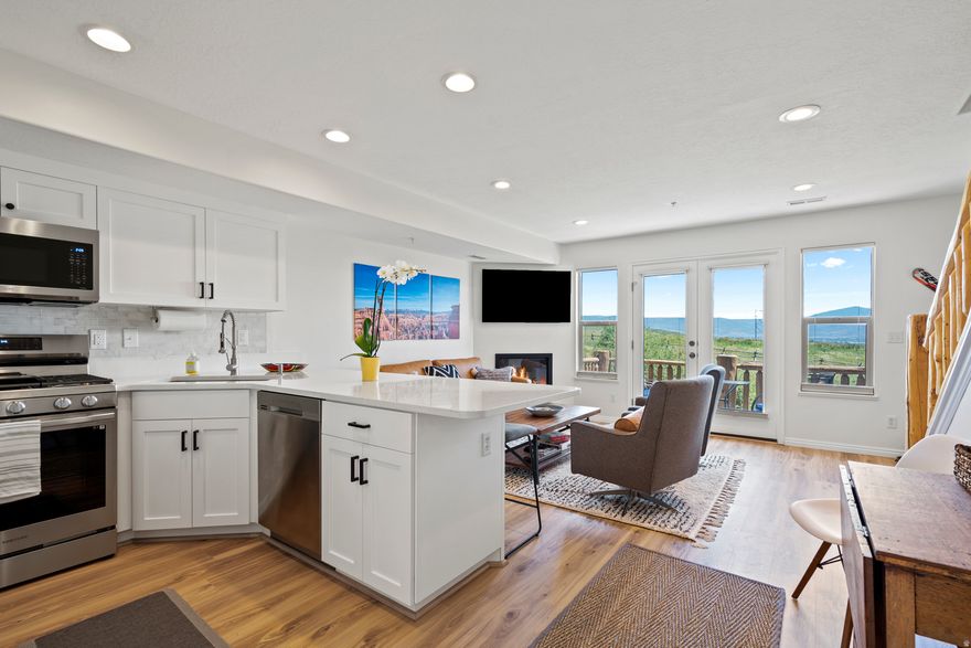 Don't miss out on this beautiful, fully furnished 2BR/2BA condo that was completely remodeled in 2023. With all new cabinets, countertops, appliances, flooring, fireplace, and bathrooms. This bright, airy condo set itself apart from other units in the community. The front and back balconies have breathtaking views of the mountains and Pineview Reservoir. The upper floor features a large primary bedroom and full bathroom, with laundry room and additional storage. The ski bus stop at up the road that will take you to Powder Mountain, and you are just minutes from Nordic Valley and Snowbasin ski resorts by car. Enjoy the summer on Pineview reservoir, and miles of hiking and biking trails. Or just relax at the community pool, hot tub, and clubhouse. Moose Hollow is also zoned for nightly or long-term rentals.