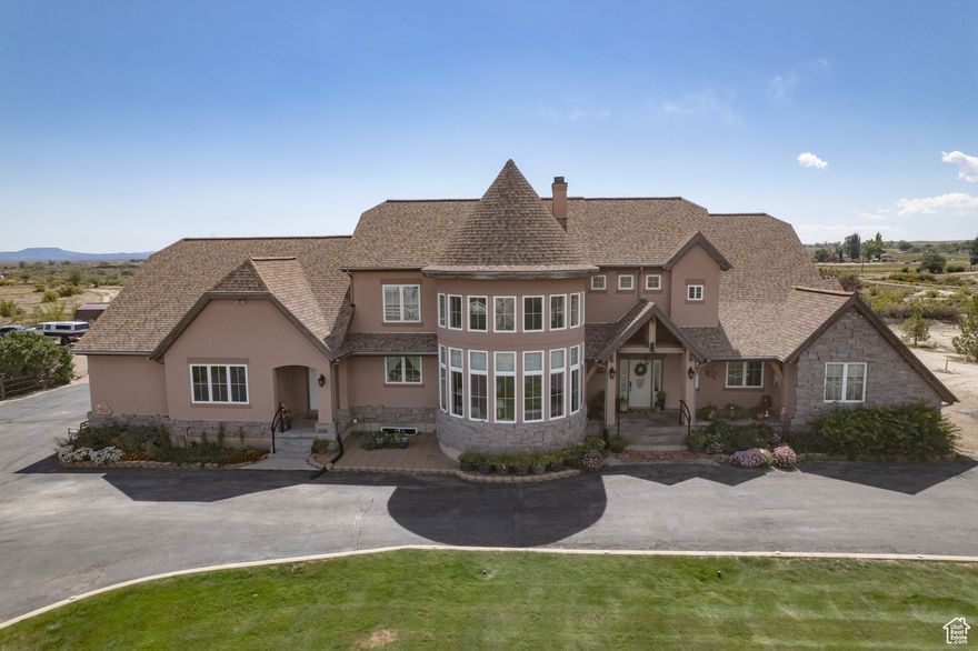 Welcome to your very own retreat in Price, where luxury meets country living on over 2.5 ACRES of mature trees, gardens, and wide-open skies. This is more than a home-it's a lifestyle.  Wake up in a grand primary suite with a cozy sitting area and spa-like bath, and enormous walk in closet! Spend mornings in the SUNROOM as the light pours in, or cook farm-to-table meals in your chef's kitchen with Wolf appliances, granite countertops, double refrigerators, and custom hickory cabinetry. In the evenings, gather around the outdoor firepit, take in the incredible mountain views, soak in the enclosed hot tub, or simply step outside and take in star-filled skies that feel close enough to touch.  Practical upgrades ensure easy living - sellers put over $100k of improvements in the house two years ago: SOLAR PANELS, NEW ROOF, water softener, and dual furnace/AC. A 3-car garage with 220V outlet, HUGE SHOP could perfect woodworking, automotive, storing boats, & toys! Plenty of parking for your RV and visitors which means you'll have everything you need for projects, hobbies, homesteading, and entertaining. 8 water shares, solar panels, and tractor could be included with the right offer!   Whether you're tending the fruit trees and garden, working in the shop, or enjoying the views of the mountains by day and glittering stars by night, this property offers space, comfort, and connection to the land-all with nearly 6,000 sq ft of custom living space.  This is the kind of home where memories are made, and where every day feels like an escape.  Schedule your private showing today and experience it for yourself.
