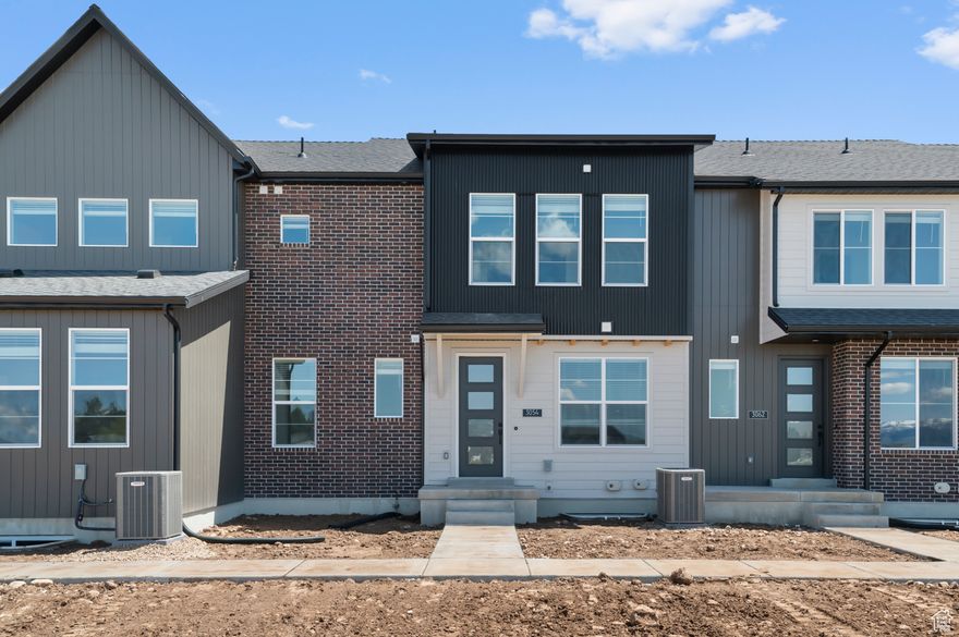 Come see this beautiful brand new Sundborn town home in a great community. Features you will find a modern kitchen with white laminate cabinets, quartz counters, and stainless steel gas appliances. Durable flooring includes carpet, laminate hardwood and tile. Enjoy a luxurious retreat in the owner's bathroom with cultured marble shower surrounds and black matte hardware. Includes full yard landscaping for a turn key move in experience. Come check it out today!