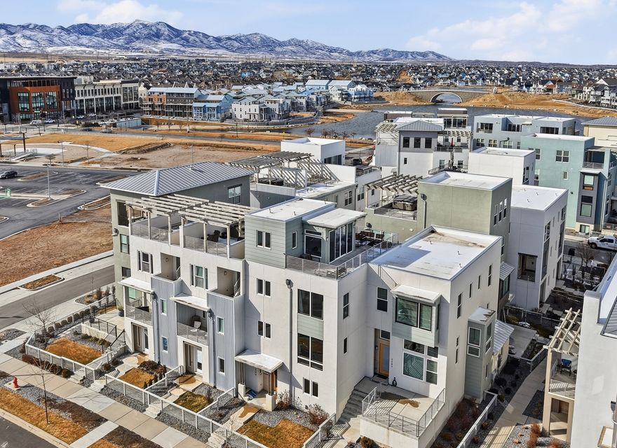 SELLER IS OFFERING $6,000 toward CLOSING COSTS when you use our preferred lender....   Modern-style home with a PRIVATE ROOFTOP TERRACE and STUNNING MOUNTAIN VIEWS in the heart of Daybreak!!   The 4th floor features an OUTDOOR ROOFTOP AREA as well as an INDOOR LOUNGE with a WET BAR and a HALF BATH. It's a rare find for the area and perfect for relaxing or entertaining guests!   Imagine a relaxing evening soaking in your HOT TUB or a fun BBQ night hosting friends and family.   Lots of UPGRADES throughout the home, including a BRAND NEW Water Heater, BRAND NEW Dishwasher, ZONED HVAC, HDMI Wiring, EPOXY FINISHED Garage flooring and more!   You'll love the great room with an OPEN CONCEPT and lots of big windows bringing in natural light, along with the spacious kitchen featuring UPGRADED Countertops, Under-Cabinet Lighting, Double Oven, Butler's Pantry and custom cabinetry.   All 3 bedrooms are on the same level with the Laundry Room for added convenience.   The flex room on the main level can be used as a 4th bedroom or an office.   LOCATION is unbeatable! Daybreak is one of the most lively areas in Utah! You're right next to Oquirrh Lake, perfect for jogging, walking, kayaking, paddleboarding or a picnic.   You're also within walking distance to shopping, restaurants, entertainment, theaters, salons, dentists and nightlife.   Enjoy farmers markets, baseball games and tons of outdoor concerts and activities during the warm months!  This is the home you've been looking for - come see it today!   Information and measurements are provided as a courtesy. Buyer is advised to see the home in person and obtain their own measurements and verify all information.