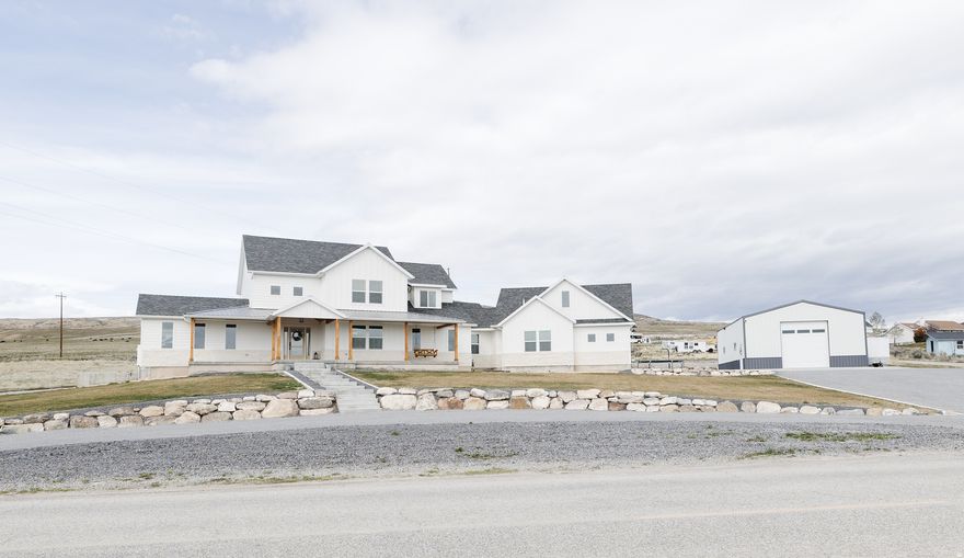 This is the home you have been waiting for. Nearly 6,000 sqft,  FULL of upgrades, and top of the line features. ADU, 30x50 shop, endless parking, views of the valley, and so much more. Minutes from I-15 and I-84 makes this location ideal. I cannot fit what this home has to offer in the description, you must see in person. Call for any and all question or to schedule an appointment!