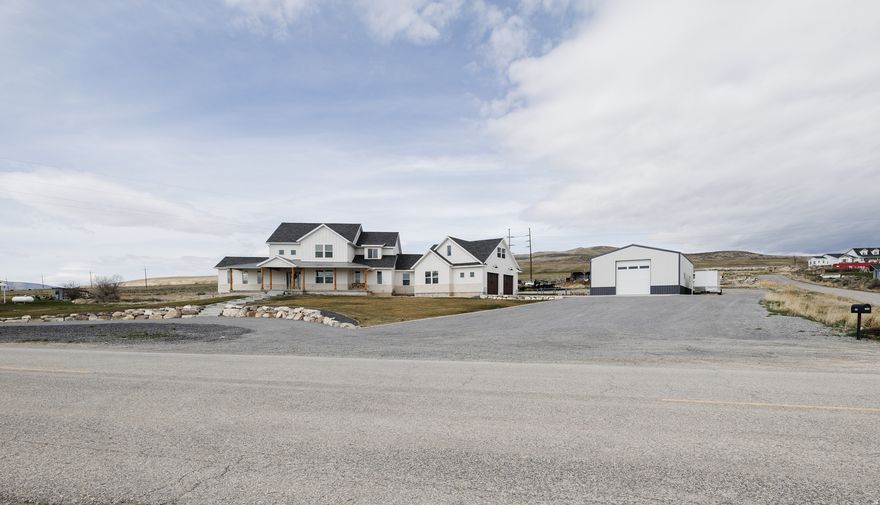 This is the home you have been waiting for. Nearly 6,000 sqft,  FULL of upgrades, and top of the line features. ADU, 30x50 shop, endless parking, views of the valley, and so much more. Minutes from I-15 and I-84 makes this location ideal. I cannot fit what this home has to offer in the description, you must see in person. Call for any and all question or to schedule an appointment!