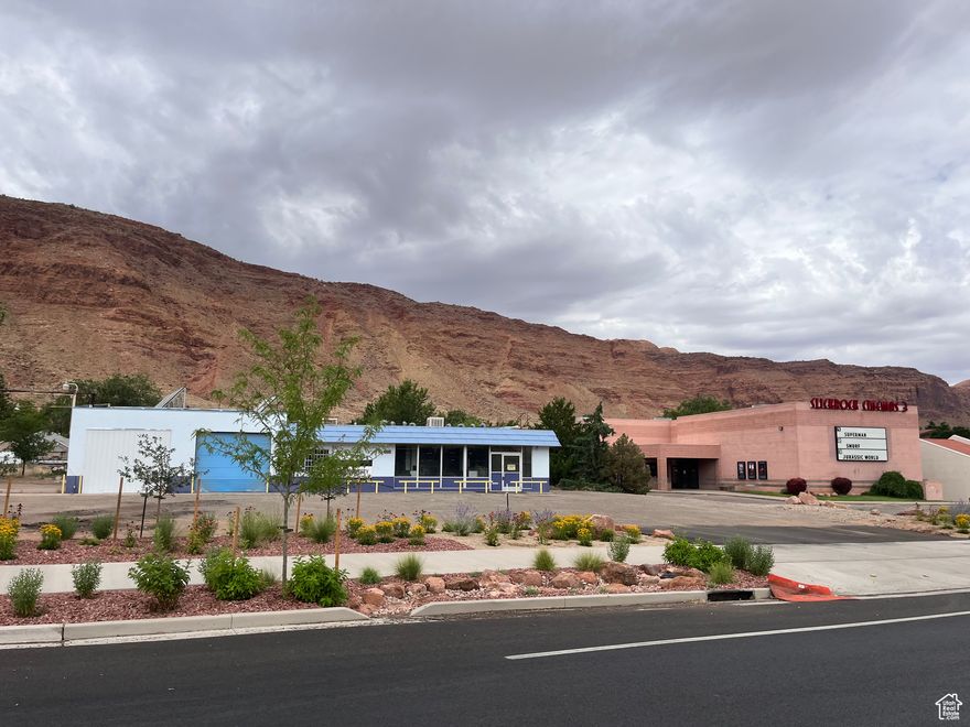 PREMIUM COMMERCIAL LOT just off Moab Main Street. This prime .60 acre lot is zoned C-4 and would be the perfect location for a Micro-Brewery and Restaurant with outdoor seating, an adventure tour company, business operation, retail establishment, Multi-Housing development, or any other use allowed by Moab City Zoning. Currently the property features a building that housed a Laundry Mat and Car Wash. A buyer could renovate the building for this same use, or could modify it, or remove it and build to suit their needs. With this premium location, large parking lot, and utilities at the property, this could be your dream business venture. Moab City has recently installed new water/sewer lines in Kane Creek Blvd along with beautiful landscaping, new sidewalks and new pavement.  Seller and this company make no warranties regarding the property or the condition of the utilities or any other aspect of the property. Buyer to do their own inspections and verify all information to their satisfaction.