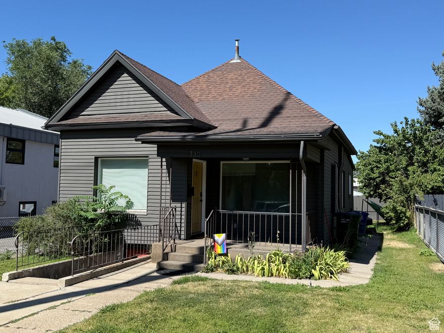 Fully LEASED. This exceptional mixed-use property presents a unique investment opportunity in a rapidly evolving neighborhood. The upstairs features two distinct spaces: a 300 sq ft office unit at the front, ideal for office use in compliance with local zoning regulations. The rear portion houses a fully rented and remodeled two-bedroom, one-bathroom apartment, providing immediate income potential. The property's versatility extends to the basement, where a separate entrance leads to a recently remodeled apartment. Ample parking options, including off-street spaces, two covered spots in the rear garage, and two additional uncovered spaces accessible from the alley. Situated on 1100 East, the property benefits from the area's ongoing transformation. The neighborhood is witnessing an influx of new businesses and residential developments, creating a vibrant and dynamic community.