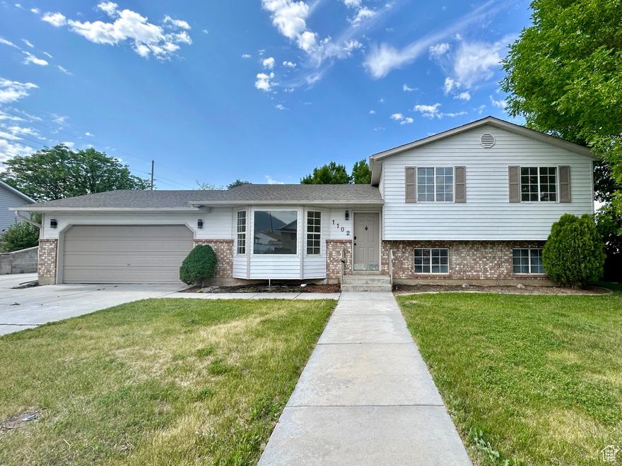 Welcome to this beautifully updated Spanish Fork gem with space for everything - including your RV!  From the moment you arrive, you'll love the oversized RV pad offering plenty of room for trailers, toys, or extra vehicles - a rare find in this price range. Step inside to fresh interior paint, new countertops, and modern flooring that give the home a bright, welcoming vibe. The open-concept layout flows seamlessly from the living room into the kitchen, making it perfect for everyday living or entertaining.  The spacious kitchen features brand-new countertops and sleek flooring that tie the space together with a fresh, cohesive look.  But the real showstopper? The expansive backyard - perfect for summer BBQs, a future garden, a playset, or just relaxing under the open sky. There's room to spread out, make memories, and enjoy the outdoors right at home.  With an attached garage, ample storage, and a quiet, established neighborhood, this home combines style and function. You're minutes from schools, parks, shopping, and dining - plus quick access to I-15 for easy commuting.
