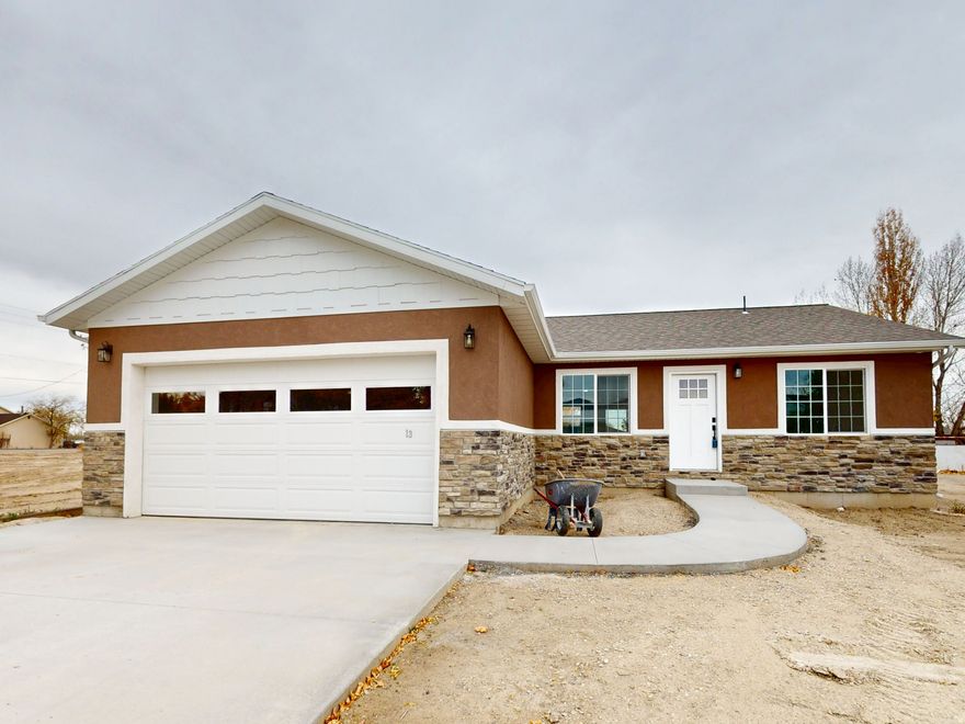 Welcome to your dream home, where comfort meets convenience in an idyllic setting. This new construction offers everything you need for a perfect family life, all on one level. Designed for ease and accessibility, this home offers a seamless living experience without the hassle of stairs. Featuring three generous bedrooms and two full bathrooms, there's plenty of space for everyone in the family. Comes fully equipped with kitchen appliances, ensuring you have everything you need to prepare delicious meals. Enjoy comfortable living year-round with efficient zone heating available in each room, allowing personalized temperature control. the spacious garage provides ample room for vehicles and storage. This home is move-in ready, inviting you to start creating memories. Situated close to an elementary school, this home is perfect for families with children. Beyond the comfort of your new home, you'll find a wealth of outdoor activities and natural beauty right at your doorstep:  first-time buyers may qualify with a $20,000 grant available on this home, which can be used for Closing costs or down payment. Ask your agent for more details. there is also money available for Emery County residents. You need to get a hold of your representative