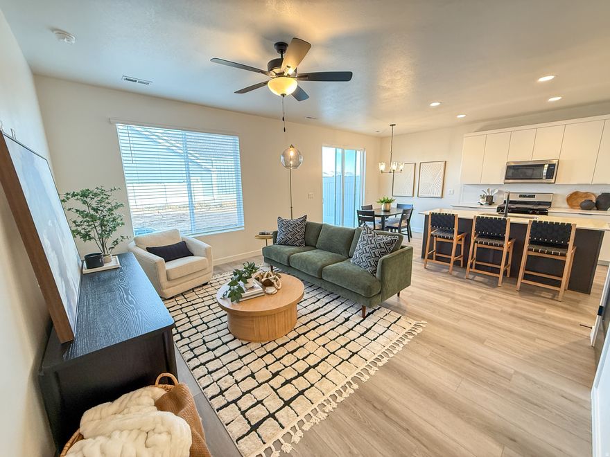 This is NOT a typo....$18,000+ INCENTIVE on this home....ask for details!! Experience modern, easy living in the heart of our one-of-a-kind Green Farm community...7 miles of walk trails, pickleball courts, 4 parks, huge dog park, 40 acres of open space and a massive stocked fishing pond.   Say goodbye to lawn maintenance and shoveling! JUST completed Move-In-Ready Townhome with NO neighbors behind!! This beautifully finished home features large windows (blinds included)  and a clean contemporary design. The main level features durable luxury vinyl plank flooring, while the kitchen shines with quartz countertops, two-tone cabinetry, a spacious island, and a gorgeous tile backsplash which is perfect whether you love to cook or simply enjoy a great gathering space. Upstairs offers comfortable living with thoughtfully designed bedrooms, double main bedroom closets and plenty of natural light. Smart features galore...ring doorbell, electronic key lock and nest thermostat. You'll love this home & community!