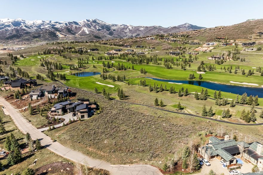 Discover a rarefied opportunity in the prestigious gated community of Glenwild, Park City's only gated golf course enclave within the Park City School District. This premier 1.18 acre unrivaled homesite, one of the last unbuilt treasures along the golf course, offers sweeping, panoramic ski hill views and a serene, flat canvas perfect for crafting your dream residence. This is the last available parcel on Foxglove Court (known for record-breaking existing home sales) and it beckons an effortless build potential and unparalleled alpine splendor at the end of the tranquil cul-de-sac. This trophy parcel sits along the 12th hole, also overlooks the 18th fairway, and ensures privacy while being just steps from the Glenwild Golf clubhouse. Walk right onto the cart path to stroll to dinner as well as embrace a year-round mountain lifestyle with hiking, biking, and snowshoe trails surrounding, all with world-class ski resorts a mere 10-minute drive away. Glenwild's top-ranked Utah golf course (Golf Digest) and gated guardhouses deliver unmatched luxury and security. HOA amenities abound, including endless trails, a lifestyle center, a playground, sports field, and a basketball court. Elevate your mountain lifestyle experience with optional Golf and Social Membership at the Glenwild Golf Club (pictured), available through a separate agreement. This is your final chance to claim a matchless homesite in Glenwild's coveted landscape.