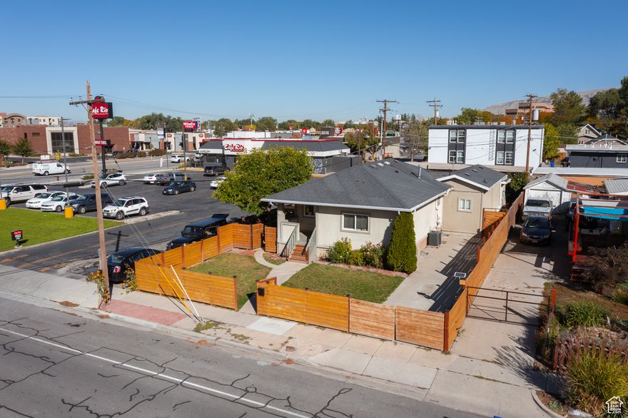 RARE!!! 3 KITCHENS, 3 LAUNDRY ROOMS, 3 SEPARATE ENTRANCES AND TWO DRIVEWAYS!!! CHECK OUT THE DRONE AND MATTERPORT FOOTAGE ON THE TOUR LINK. Units available to show AFTER an offer is accepted. This home has been fully remodeled. The main level has an updated kitchen with granite countertops, stainless steel appliances, and updated bathroom. The basement features its own exterior entrance with a new kitchen, upgraded bathroom and laundry. The backyard studio has a kitchen, laundry, and updated bathroom with a walk-in shower. On the back of the studio is an attached storage shed. Fully fenced yard, automatic sprinkler system, 2 driveway gates & nice appliances. Radon mitigation system installed. Conveniently located just one block from the Sugar House Streetcar stop (S-Line). WINCO across the street. 10 minutes from Home Depot, Walmart and Costco. Just 3 minutes to interstate access, 15 minutes to the state capital or the University of Utah! BASEMENT RENTED FOR $1,400/MONTH (Ends Feb 2026). UPSTAIRS RENTED FOR $1,600/MONTH(month to month) STUDIO FOR $800/MONTH. TENANTS PAY ALL UTILITIES AND LAWN MAINTENANCE. All information deemed reliable but is not guaranteed and should be independently verified.