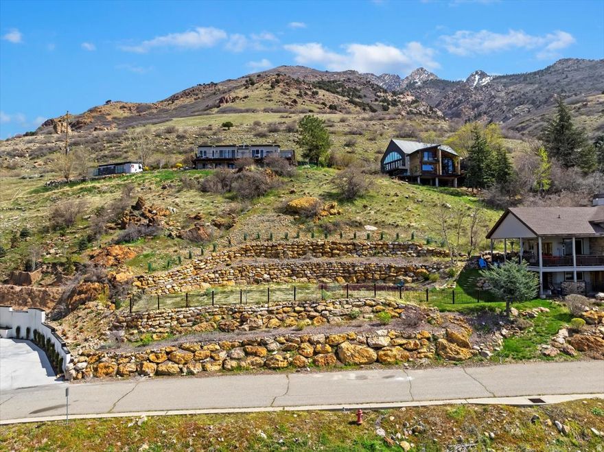 Stunning 1/2 Acre Lot in Coveted Holladay with Panoramic Valley Views Discover the perfect canvas for your dream home on this rare 1/2 acre lot nestled in the heart of Holladay. Perched on a gentle slope, this property offers breathtaking, unobstructed views that stretch across the Salt Lake Valley - perfect for enjoying vibrant sunsets and the sparkling city lights at night. Surrounded by upscale homes, the lot combines peaceful seclusion with close proximity to top-rated schools, shopping, dining, and outdoor recreation in Millcreek Canyon and the Wasatch Mountains. Utilities are available at the street, and the lot provides ample space for custom building with room to spare for landscaping or garden. To make your vision even easier to realize, a completed Geotechnical Study, Slope Stability Report, and future build plans are included with the sale. This valuable information saves you time and money, and offers a head start on designing and permitting your custom home.