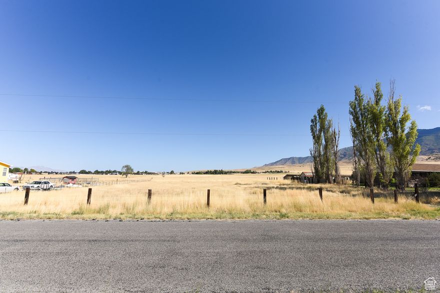 Fantastic opportunity! Build your dream home in the desirable East Side of Erda- Bryan Road! This is land only! Buyer to stub utilities, drill a well, and provide their own water! This property will need water rights. It will be approximately 1.5 acre-feet to service a home and small yard. Seller found water for $40,000 an acre ft. The Gas Lines are 2 houses away. The Power is in the street. The lot sits between House #1395 and #1443. Explore this exceptional opportunity to own a 1-acre lot in a tranquil agricultural zone, just a mile from SR36. While comparable properties on the east side of Erda in Happy Acres are listed higher, sharing a well and situated near a busy road, this lot offers a more serene setting on a quiet dead-end road.  What sets this property apart is its prime location and potential. Don't miss out on owning a piece of peaceful land in a desirable area! Seller is offering seller financing for this property as well.