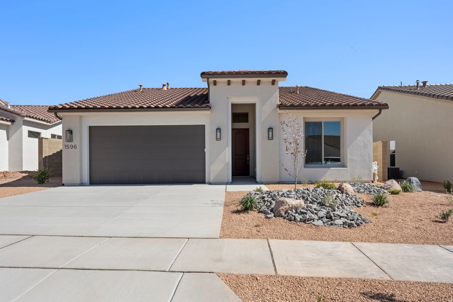 Discover the Mojave floor plan, a thoughtfully designed home offering 3 bedrooms and 2 bathrooms within 1,840 square feet of elegant living space. With tall ceilings and a spacious side patio just off the kitchen, this home maximizes your indoor and outdoor dining experience. The contemporary kitchen features optional gourmet enhancements, while the primary suite boasts a luxurious ensuite bathroom. Embrace the vibrant lifestyle in the Solis community, where resort-style amenities elevate your everyday living.