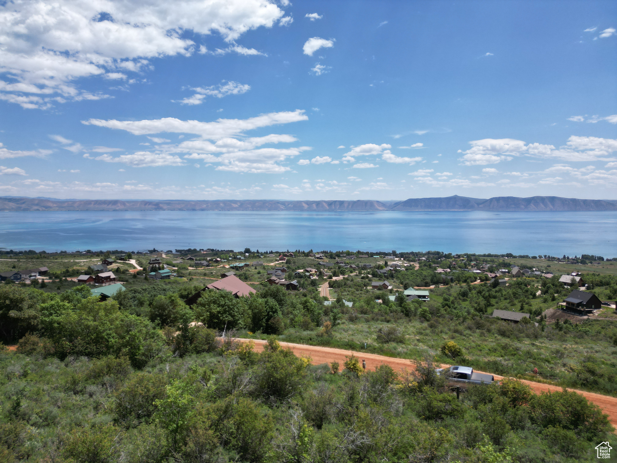 Top of the Bear Lake West, wooded secluded building lot. Views of Bear Lake from north to south. Build your Bear Lake Hideaway or escape to live your dream in away from the hustle. Year around access, amenities include members discount for golf, summer outdoor heated pool, beach access for BLW owners only, pickleball / tennis courts. Adjoining lot 405 to the south is also available. No short term rentals in this HOA