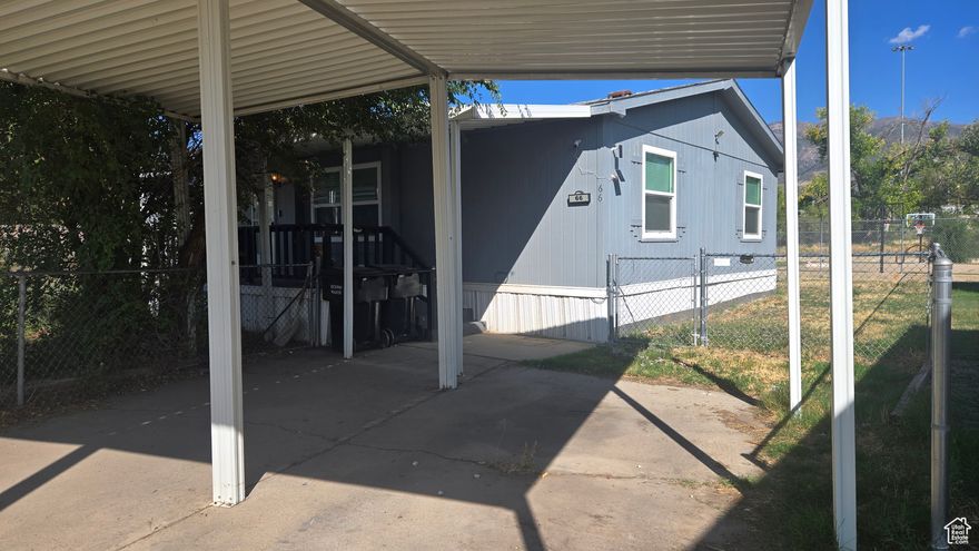 This well-maintained manufactured home features an open floor plan with tasteful updates and ceramic tile flooring throughout. Modern appliances add convenience, while vaulted ceilings, large windows, and a skylight provide abundant natural light.  The primary and secondary bedrooms are positioned at opposite ends of the home, offering privacy and flexibility. A large covered front patio, surrounded by neighboring landscaping, creates a sense of seclusion and outdoor comfort.  The property is conveniently located near shopping and dining, with direct access to the Ogden River Parkway and Centennial Trail. Riverside Village also provides quick connectivity to I-15, I-84, and the Adams Avenue Parkway.  Recent updates include a new water heater, furnace, and central air system (August 2024).  Specialized mobile home financing options may be available.  Square footage figures are provided as a courtesy estimate only and were obtained from independent measurements. Buyer is advised to obtain their own independent measurement.