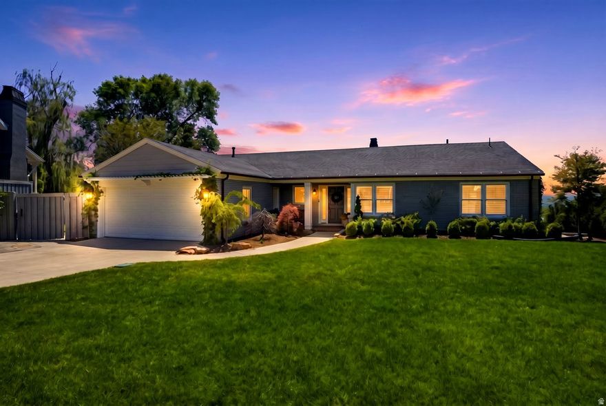 Situated on nearly half an acre of prime East Bench real estate, this pristine property checks every box, size, location, and luxury. Each space has been thoughtfully refined with precision and the highest quality finishes. The main level includes a perfectly-appointed kitchen which connects to the light-filled dining room. A large, sophisticated living room opens to the deck, built in 2019 with premium Trex decking, surrounded with valley and mountain views.  In addition to the immaculate design, the home's functional systems were also upgraded during the remodel in 2022, including: electrical, plumbing, framing, sheetrock, windows, flooring, appliances, and AC compressor. The walk-out basement was fully renovated in 2025, including the furnace, tankless water heater, soft water filtration system, carpet, and custom window treatments. The exterior benefitted from a thorough refresh with new paint, masonry work, copper gutters and downspouts, new fascia and soffit, and elegant stone hardscaping.  Enjoy peaceful privacy with the home ideally situated on a turnout along Skyline Drive, eliminating through traffic directly in front of the property. The expansive backyard offers ample space for a future swimming pool, sports court, or additional outdoor entertaining areas. Located minutes from the University of Utah, Bonneville Golf Course, hiking and biking trails, downtown Salt Lake City, and world-class skiing.
