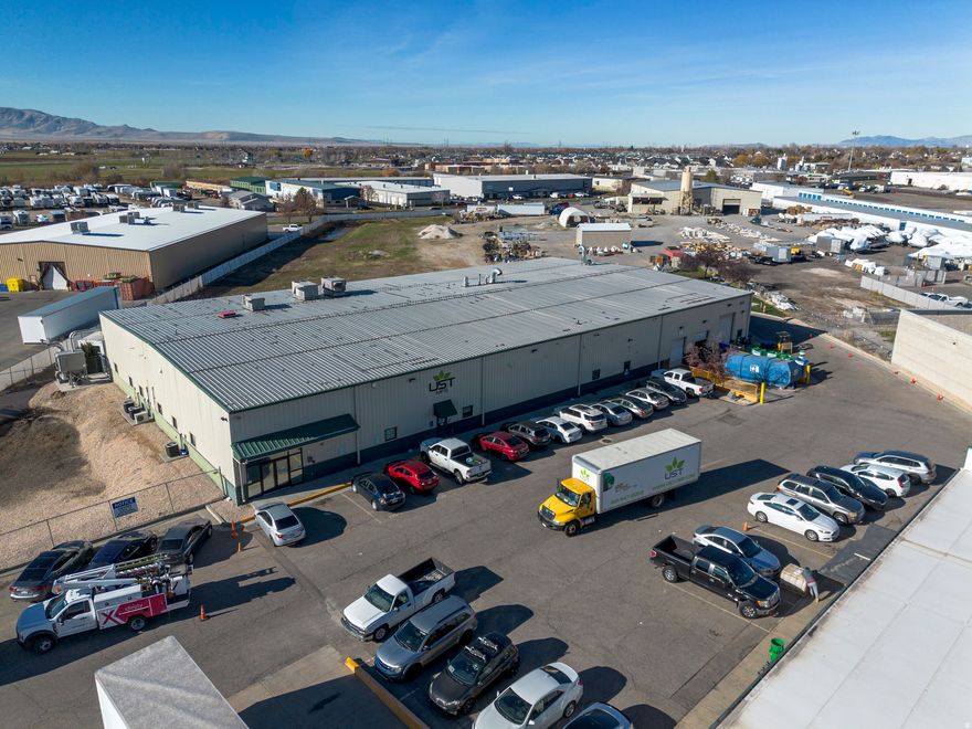 Great investment opportunity! Currently leased by a nutraceutical and supplement manufacturer, this building supports specialized production uses with upgraded power, warehouse, ample dock and grade-level loading. Best if purchased with adjacent 851 N. McCormick Way. Built in 2000, this steel distribution warehouse and office building features over 4100 SF of office and approximately 14,700 SF of warehouse/manufacturing space.  This building's layout is set up for numerous industrial uses including pharmaceutical and supplement type manufacturing, storing and primed for shipping logistics.  The building is fully climate controlled with both heating and cooling systems and features industrial-grade lighting, ventilation, and exhaust systems, as well as a comprehensive fire-sprinkler set up for safety and compliance. The exterior is professionally improved with paved parking.
