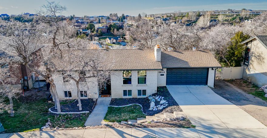 Tucked away on a quiet, secluded street in South Ogden, this beautifully updated home offers the perfect blend of privacy, comfort, and stunning scenery. Enjoy breathtaking views of the Ogden Valley right from your deck-an ideal spot for relaxing evenings or morning coffee.  Inside, the home features a bright open living space centered around a cozy fireplace, creating a warm and inviting atmosphere. The remodeled kitchen showcases modern finishes and updated appliances, perfect for both everyday living and entertaining.  Recent upgrades include newer windows, flooring, paint, fixtures, and appliances, giving the home a fresh, move-in ready feel. Outside, mature trees provide shade, beauty, and additional privacy, enhancing the peaceful setting.  With its secluded location, scenic views, and thoughtful updates throughout, this South Ogden home is a rare find.