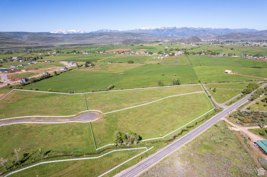 Discover a rare opportunity to own land in one of the most peaceful corners of Kamas Valley. Located just minutes from Park City, Stewart Estates offers only four 5-acre estate-style lots in a secluded yet accessible setting. These expansive parcels are equestrian-zoned and ready for your dream home - whether that's a mountain modern retreat, a legacy ranch, or a timeless farmhouse.  With sweeping views, open skies, quick river access, and a quiet landscape, Stewart Estates offers a lifestyle that's both grounded and inspiring. Wake to sunrise over the Wasatch Range and spend your days in connection with nature, family, and the land itself. This is a place for those who value space, freedom, and privacy - without sacrificing access to the amenities and energy of nearby Park City.  Developed by the visionary behind Wolf Creek Ranch, Stewart Estates blends thoughtful planning with natural beauty. With endless trails for hiking and outdoor recreation, an elegant entry monument, and perimeter fencing add to the neighborhood's character and charm.  Whether you're seeking open land for horses, a basecamp for outdoor adventures, or a peaceful place to build your forever home, Stewart Estates offers a one-of-a-kind chance to live with intention in a truly special setting.