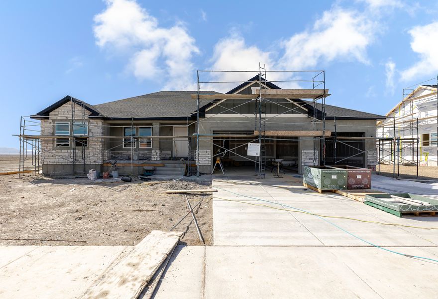 Welcome to Rose Ranch-an exciting new community in the heart of Eagle Mountain! These thoughtfully designed single-family homes shine with larger lots, giving you space for a three-car garage and plenty of outdoor living. Rose Ranch offers a vibrant, community-focused lifestyle with pickleball courts, the Eagle Mountain Ranch Bike Park, nearby schools, and easy access to local favorites like The Ranches Golf Club, Utah Lake, scenic parks, and trails. Surrounded by stunning mountain views, it's the perfect place to call home. Contact us today to start planning your future in Rose Ranch! (EMILY LOT 122)