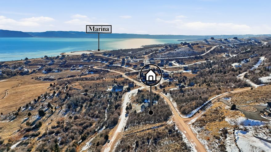 Stunning Vacant Land Opportunity in Garden City! Discover the perfect canvas for your dream home in the sought-after Swan Creek Village HOA. This beautiful wooded lot features a gentle slope and provides easy access to roads, as well as essential utilities including sewer, power, and water. Enjoy breathtaking, unobstructed views of Bear Lake's stunning blue waters that stretch as far as the eye can see.  The seller has already paid the $5,000 road impact fee, and buyers are encouraged to verify the potential transfer of this payment. Additionally, detailed engineering drawings for a spacious 5,000 square-foot home and a current survey of the property may be available to pass on to the buyer.  Immerse yourself in the tranquility of this serene area where wildlife such as deer and rabbits frequently pass by. HOA does not allow short-term rentals. www.swancreekvillage.org HOA fee includes culinary water use, snow removal & road maintenance