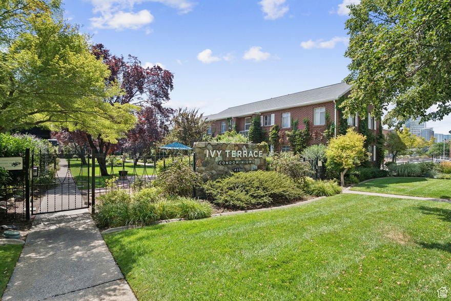 Welcome to this Top-Floor Downtown Condo in Gated Historic Community. Perfectly situated within walking distance of top-rated restaurants, vibrant bars, boutique shops, live concert venues, and grocery stores. Enjoy the best of city living with unmatched convenience and charm! This top-floor unit is one of only two in the building surrounded by windows on three sides, flooding the space with natural light and offering a uniquely open and airy feel. Pride of ownership shows throughout, from the bright and spacious two-bedroom layout to the thoughtfully designed galley kitchen featuring ample cabinetry and a wide pass-through that opens to the main living area. The bathroom and both bedrooms are generously sized and filled with natural light, creating a warm and welcoming atmosphere. Additional highlights include: Covered Parking, Immaculately Landscaped Courtyard, Optional Personal Garden Plot, Historic Brick Exterior Adorned with Summertime Ivy, Secure Gated Community, 150 Sq. Ft. of Private Basement Storage This condo blends character, comfort, and convenience in a setting that truly feels like home. Don't miss your chance to own this rare gem in the heart of downtown! All information provided as a courtesy. Buyer and buyer's agent to verify all details.