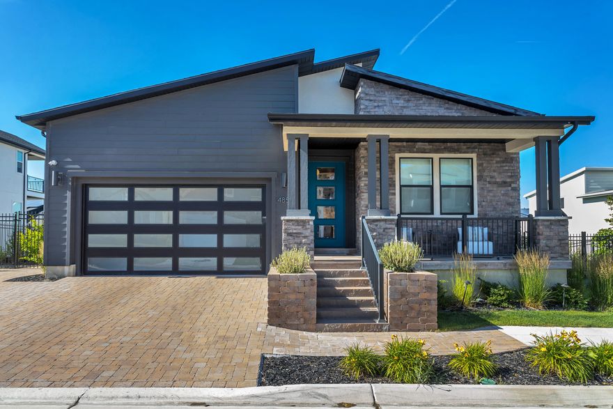 Located in the highly sought after Rosecrest master planned community, this beautifully upgraded former Toll Brothers model home blends luxury, modern design, and exceptional craftsmanship with over $100,000 of high-end finishes. Located in a gated community with its own park, you'll enjoy amenities such as a clubhouse, fitness center, and large pool. The open concept main level is designed for both relaxation and entertaining with high ceilings, a sleek modern fireplace, upgraded custom cabinetry and shelving. Dual sliding glass doors extend from the great room to the covered patio, framing beautiful mountain views and creating seamless indoor/outdoor living. The gourmet kitchen features premium finishes, upgraded cabinetry, stainless steel appliances, a butler's pantry, and a spacious walk in pantry. Adjacent dining area offers an elegant yet comfortable setting for everyday meals and special gatherings. The primary suite provides a retreat with a spa inspired bathroom, oversized walk in shower, and generous closet space. The partially finished walk out basement includes a kitchenette and wine cooler, offering flexible space for entertaining, a media room, or guest accommodations, with potential for additional bedrooms and bathrooms. A large sliding glass door brings in abundant natural light and opens to the lower covered patio, leading directly to the resort style ground hot tub. Fully landscaped backyard designed for elevated outdoor living, complete with sod, mature trees, fencing, patio space, automatic outdoor lighting, and rock walls. Additional features include a paver front entry driveway with curb cut and extended side parking. Conveniently located just minutes from shopping, dining, and entertainment, this exceptional home is truly a must see. Schedule your tour today! Photography was taken last summer while the home was staged; the furniture has since been updated.