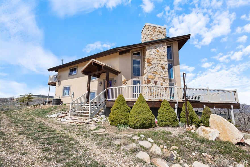 OPEN HOUSE June 14th 10:00 AM-12:00 PM !!  Unrivaled 360 VIEWS at Lake Rockport Estates  Perched atop Summit County's most coveted ridge, this spectacular 4bedroom home commands panoramic vistas of Rockport Reservoir, Coalville Valley, Lewis Peak, Snyderville Basin, Olympic Park, Canyons Village, Park City Mountain, Deer Valley, Mt. Timpanogos, Kamas Valley, and the Uintas.    25 minutes from Park City!!  Turnkey Updates & Luxurious Finishes          New Paint & Flooring: Freshly revitalized interiors throughout.          Vaulted Great Room: Floortoceiling windows and soaring ceilings instantly draw the eye to the pristine lake and mountain backdrop.          Gourmet Kitchen: Highend appliances and thoughtful layout open seamlessly to the gathering area.          Massive Stone Fireplace: A dramatic focal point for cozy evenings.  Thoughtful Floorplan & Private Retreats          MainLevel Master Suite: Spacious bedroom with a luxurious bath and expansive walkin closet.          Three Additional Bedrooms + Loft Office: Each upstairs room enjoys its own deck with commanding views; the loft makes an ideal workspace overlooking the lake.          Wraparound Decks: Outdoor living on three sides for sunrise coffees and sunset cocktails.  Exceptional Property & Location          2.29 Acres of Privacy: Gently sloping, flat lot set well back from neighbors-your own secluded oasis.          Deep Garage & Covered Carport: Ample storage for vehicles, toys, and outdoor gear.          20,000Gallon Water Storage: Buried tanks ensure reliable yearround water supply.    Buried 1,000 gallon propane tank      Convenient Access: Just 45 minutes to Salt Lake City International Airport and downtown Salt Lake.  This home delivers the ultimate blend of luxury updates, thoughtful design, and breathtaking natural beauty. Don't miss your chance to own the best views in Summit County-schedule your private tour today!  Ample parking for family gatherings. Home Tour included in listing!  Take a look and schedule a showing!