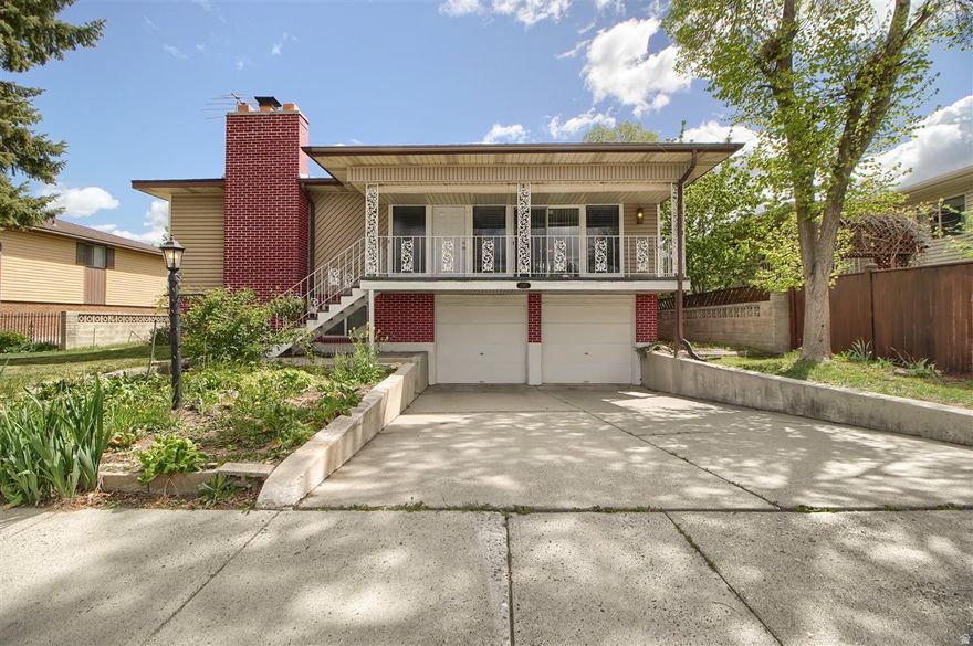 This well maintained Raised Rambler has a newly carpeted large living area and a casual dining area with hardwood floors and a vintage chandelier. Cozy kitchen with new appliances and original wood cabinets updated with granite counter tops for an amazing retro vibe. Two large bedrooms upstairs with large closets having white doors with trim and a shared full bathroom.  Downstairs has one bedroom with large closets, a family room with a fireplace, a bathroom with shower and laundry. Nice big backyard has a covered deck and fruit trees.  Centrally located near to schools, parks, transportation and shopping areas.  Inside updates: Repainted, granite countertops and new carpet, HVAC , water heater.  Outside: Replaced roof in 2014, new carpet for outside front and back porches on day of this listing. Square footage figures are provided as a courtesy estimate only and were obtained from Salt Lake County Records.  Buyer is advised to obtain an independent measurement.