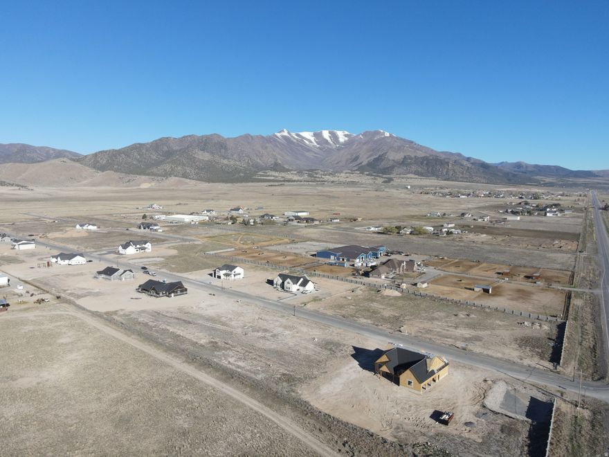 Horse Property with a beautiful view of the Oquirrh Mountains and Cedar Valley. No HOA. Bring your own builder and build your dream home. Browns Meadow Lot 102. Additional lots are available. Fiber, Power, and Water are stubbed to the property. Acreage is based off recorded plat.